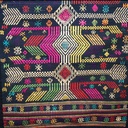 coperta-realizzata-a-telaio-e-ricamata